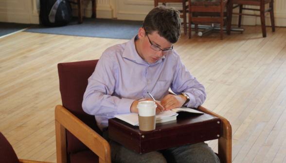 A student studies props in the Commons