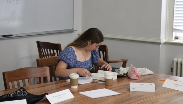 A student studies at the classroom table