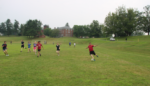 Students play soccer on the athletic field