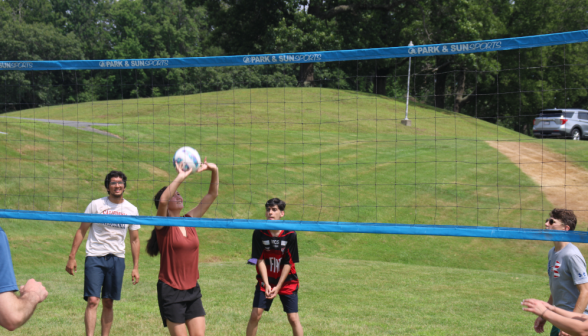 Students play volleyball