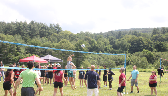 Students play volleyball