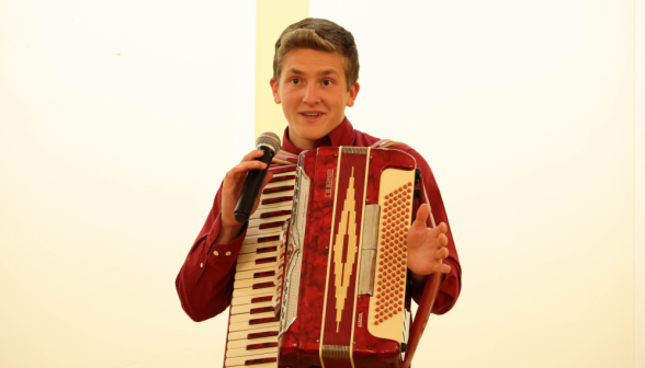 A freshman plays his accordion