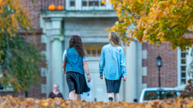 Students walk on New England campus