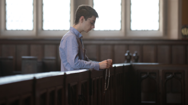 Student prays the Rosary