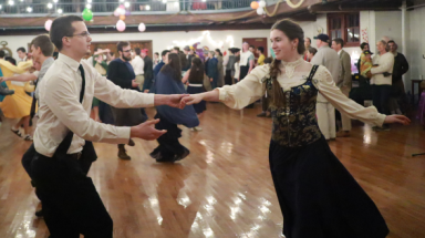 A pair of students dance