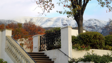 A view of the snow-capped mountains in California behind the stairs to the Commons
