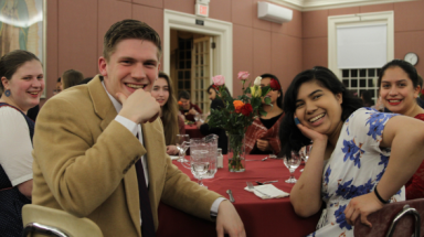 Students pose for the camera at the Rose Dinner
