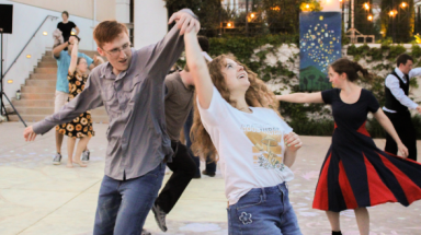 Students dance on Gladys patio
