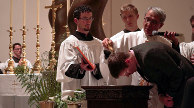 Fr. Chung pours the water of Baptism
