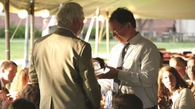 Mr. Flatly recieves a gift from President O'Reilly