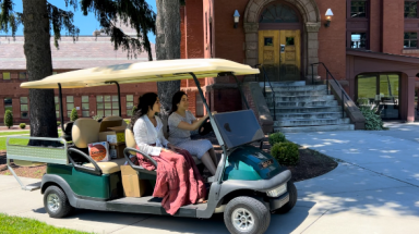 Students in golf cart