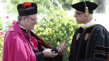 Bishop Barron receives the the Saint Thomas Aquinas Medallio