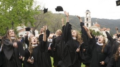 Graduates toss their mortarboards